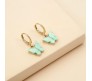 Gold Toned Huggie Hoops With Attached Butterfly Charm Hanging Earrings Gold Plated For Women and Girls Cyan